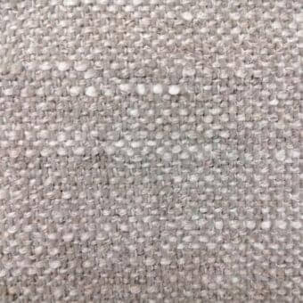 Woven fabric sample in muted gray with off-white flecks, dense irregular weave, textured nubby finish, labeled “ditre italia martin 102”.